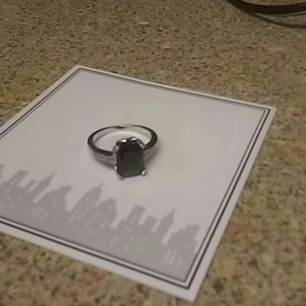 Black stone with silver band ring